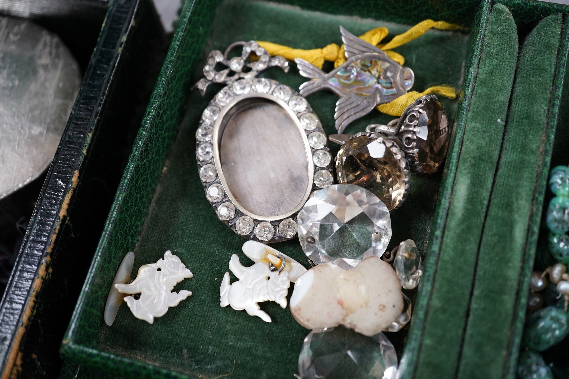 A quantity of assorted mainly costume jewellery in two boxes, including a coral bead necklace. Condition - poor to fair